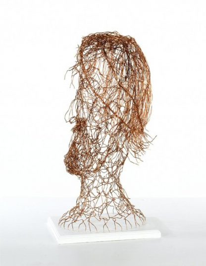 side on view of copper wire head, emphasis is on highlighting hair, beard and mustache, head is flexible and touch friendly