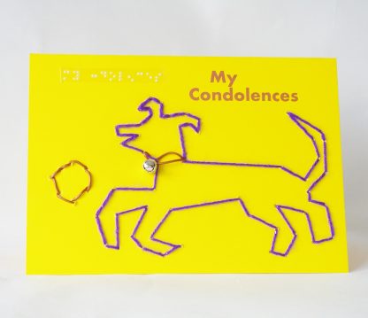 Purple sparkly dog with leather collar and silver bell audible, playing with leather ball on landscape yellow card